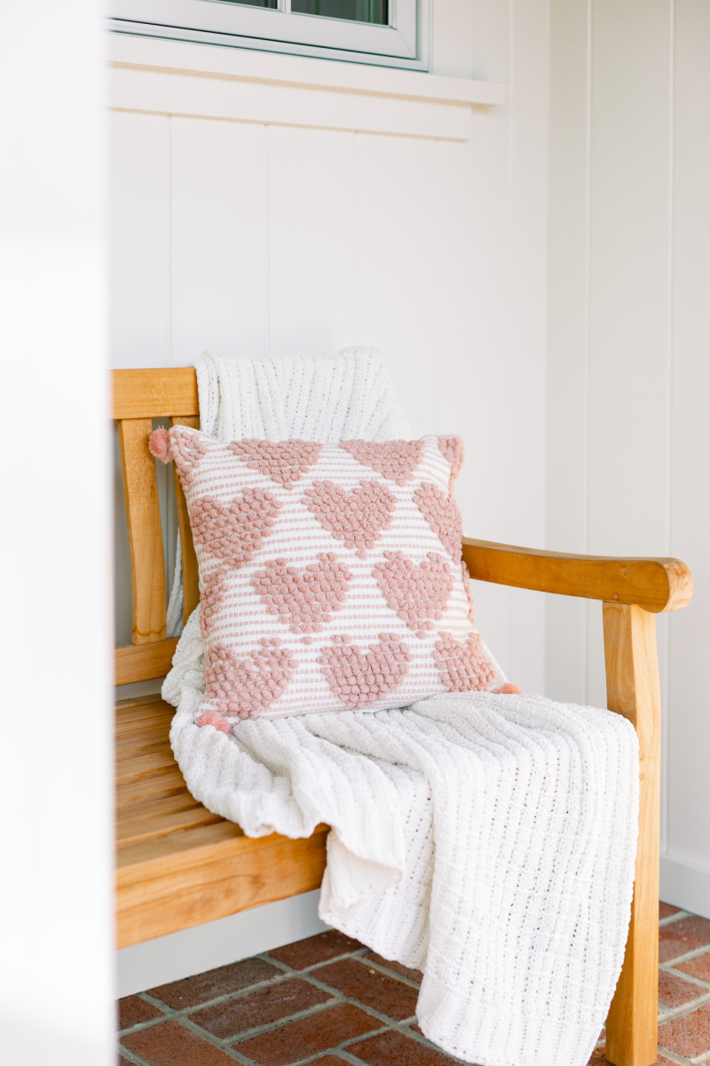 Teak Bench with throw and heart pillow
