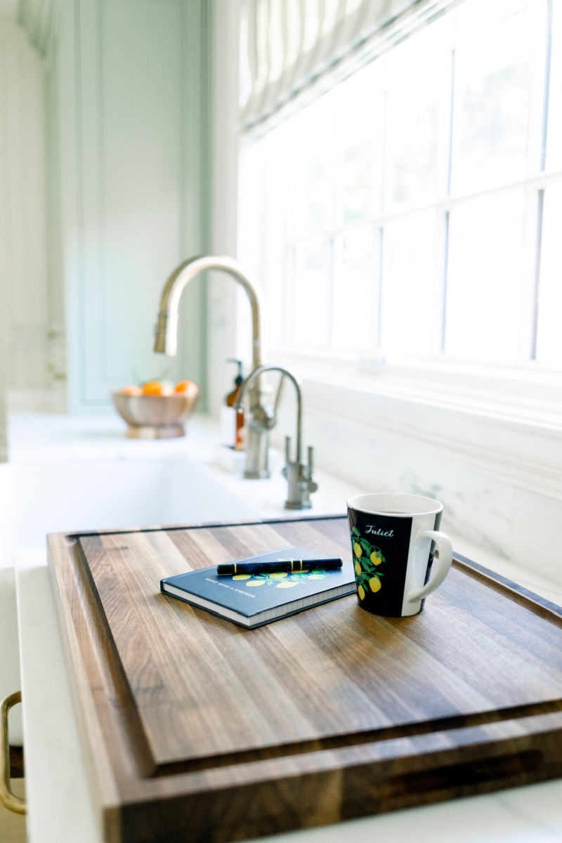 Kitchen faucet, cutting board, oranges
