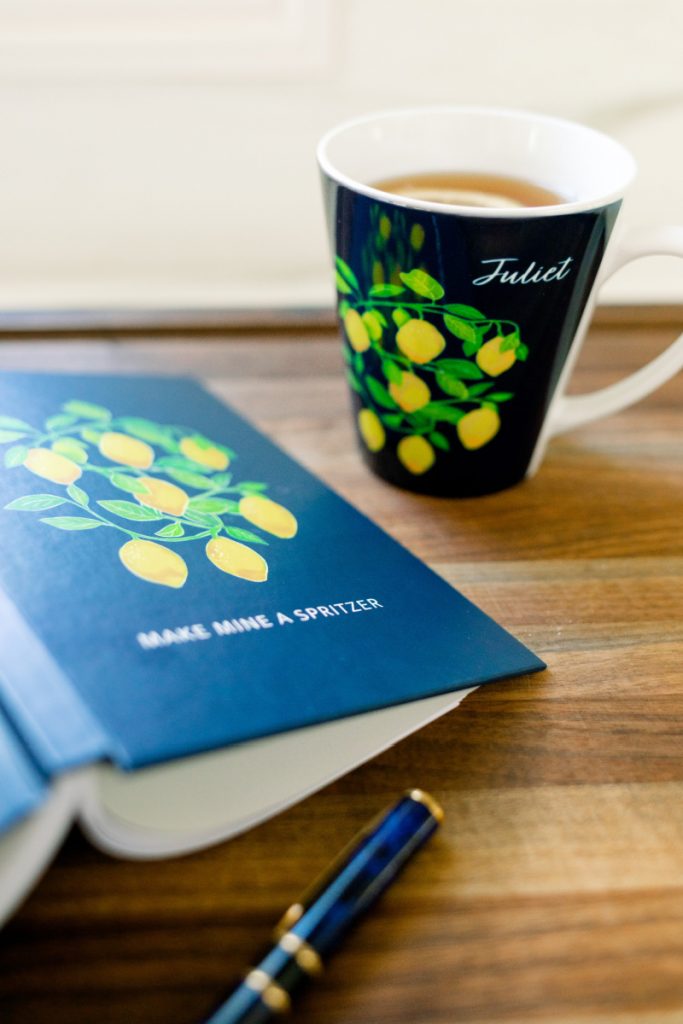 Citrus themed notebook and coffee cup