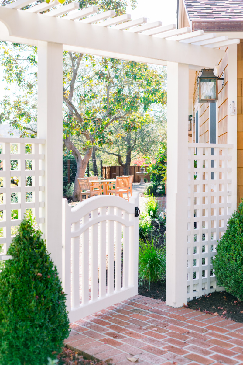 White trellis fence, arbor and gate