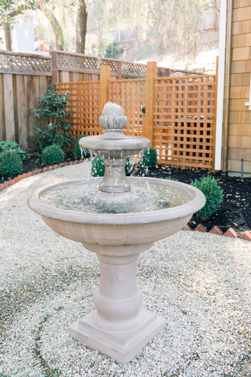 Garden fountain and lattice fence and gate