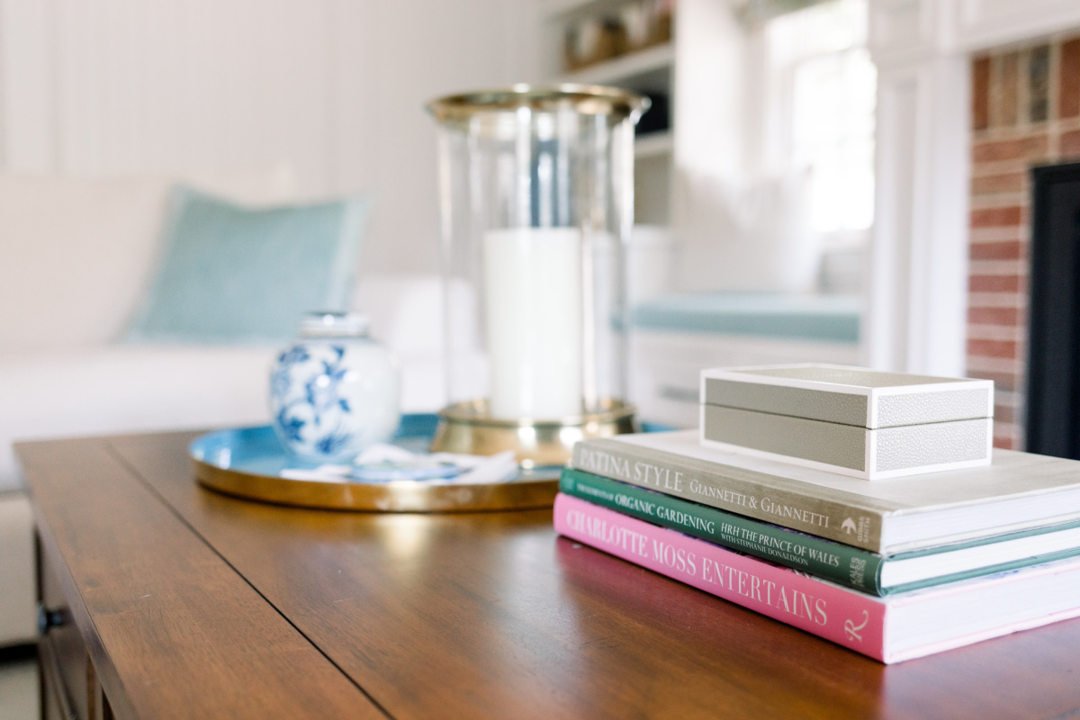 Coffee table vignette, books, candle, tray