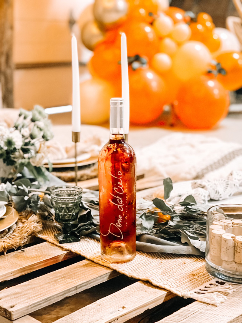Picnic set up in winery with rose wine bottle