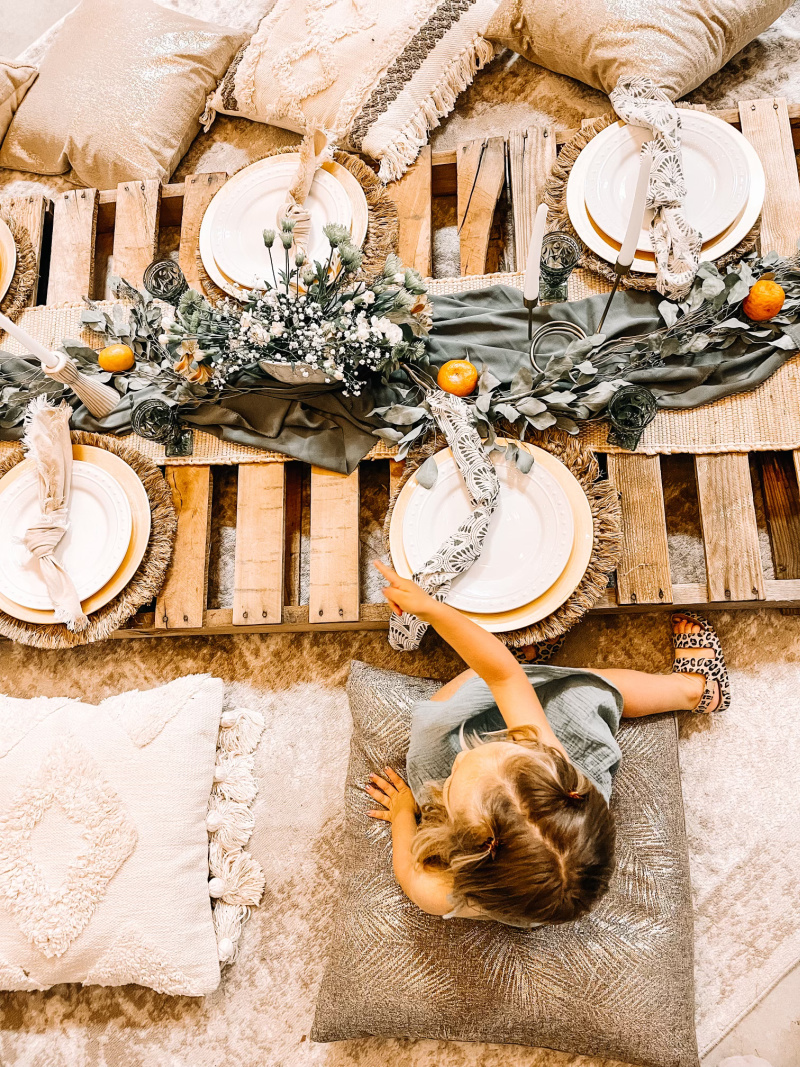 Child sitting at picnic table