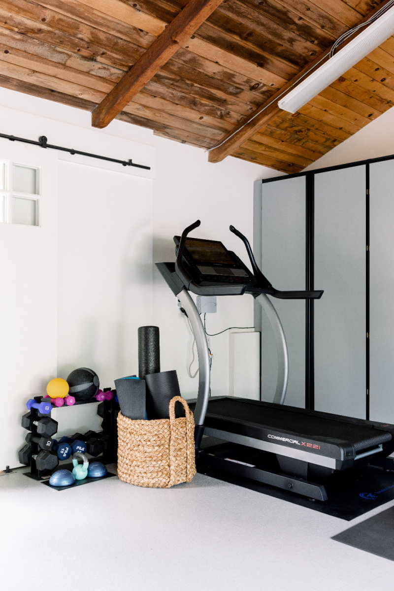 Treadmill and weights in garage gym