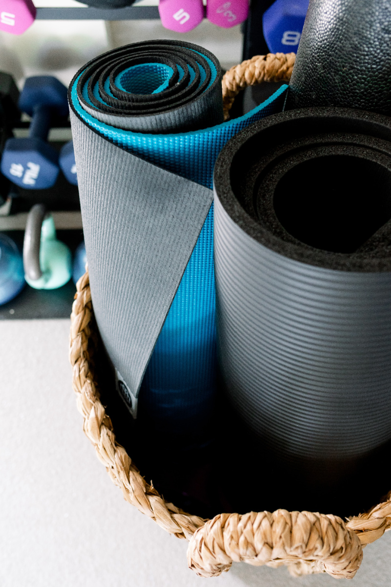 Yoga Mat in basket and weight rack