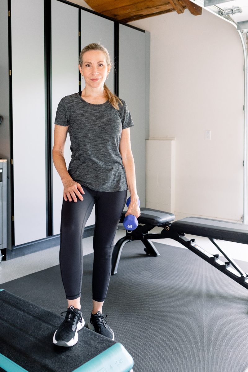 Woman in garage gym with workout step
