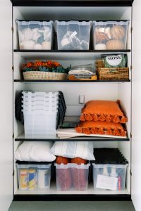 Fall decor on garage storage shelves