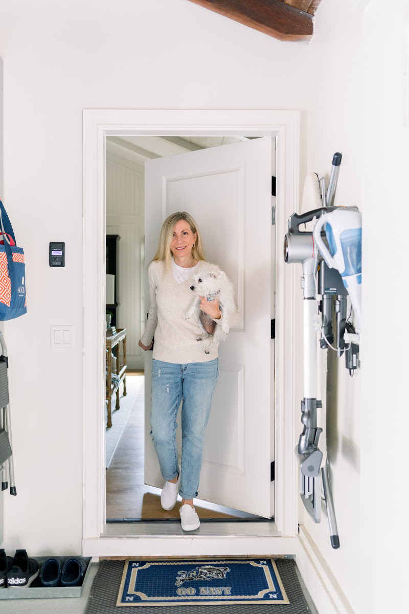 Woman and dog entering garage