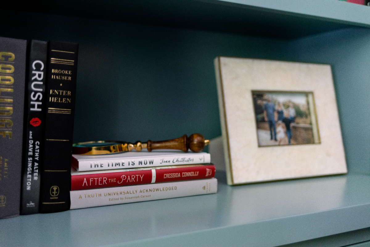 Books and photograph on shelf