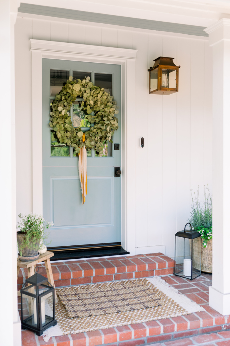 Blue dutch door with eucalyptus wreath