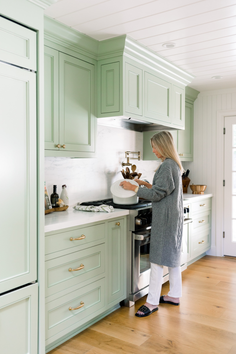 Woman at stove stirring pot
