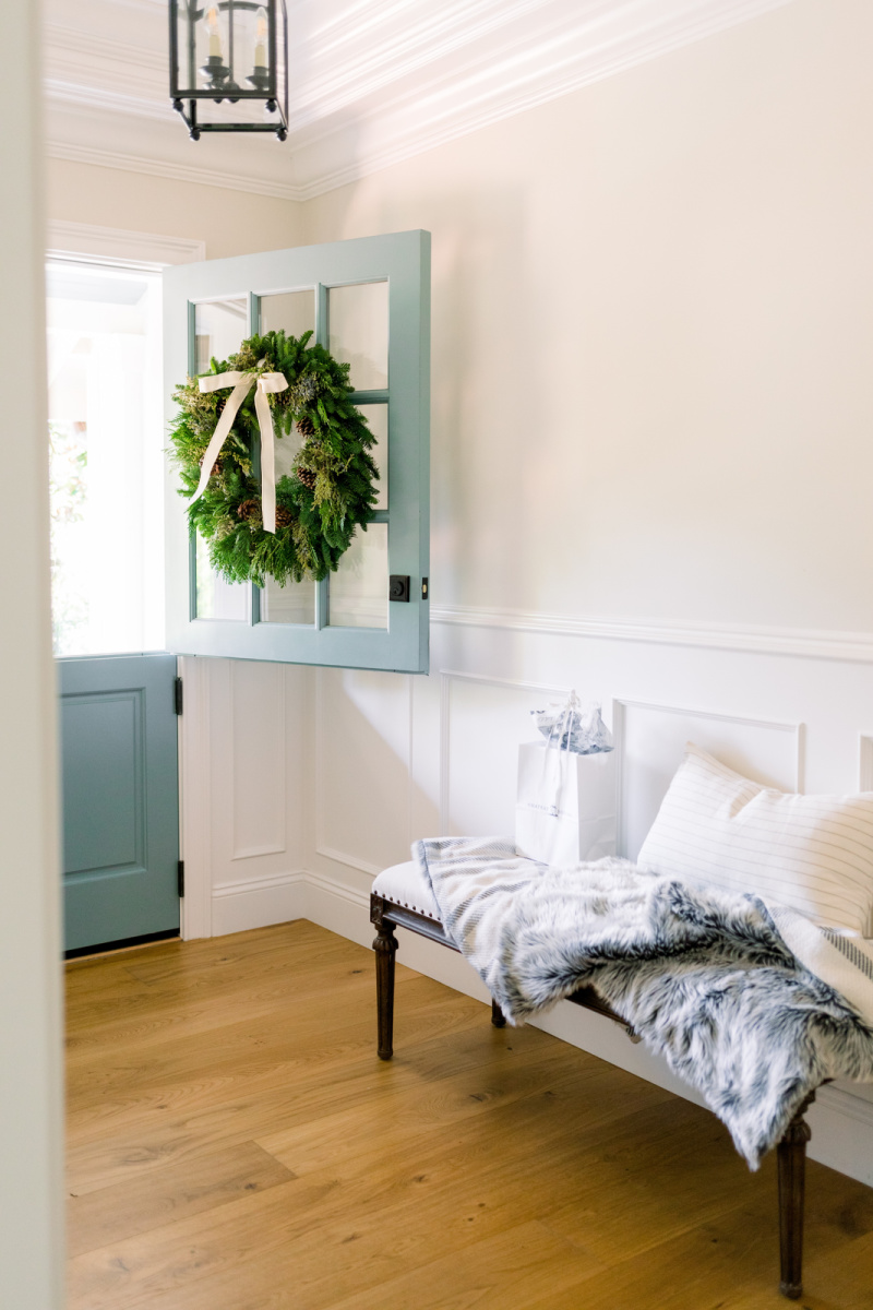 Blue Dutch Door open into foyer with Christmas wreath