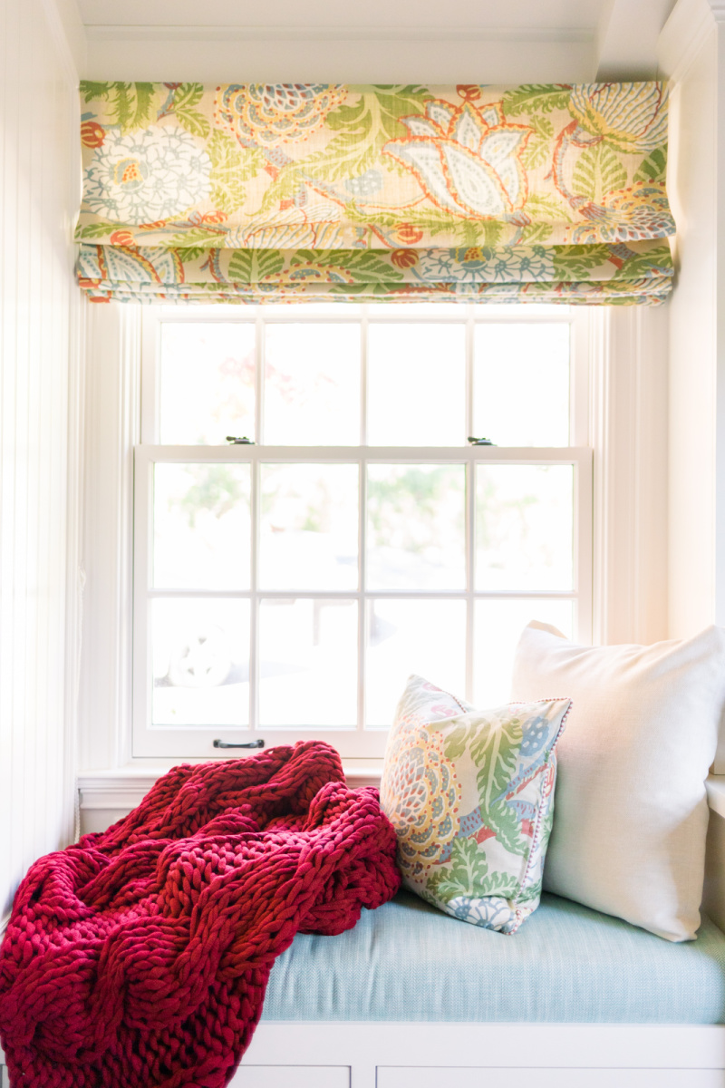 Window seat with Christmas throw blanket