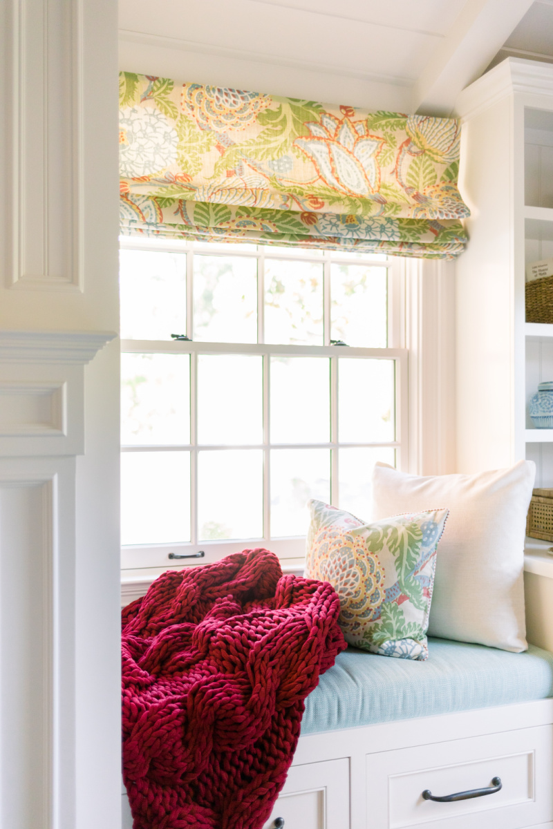 Cranberry throw in window seat