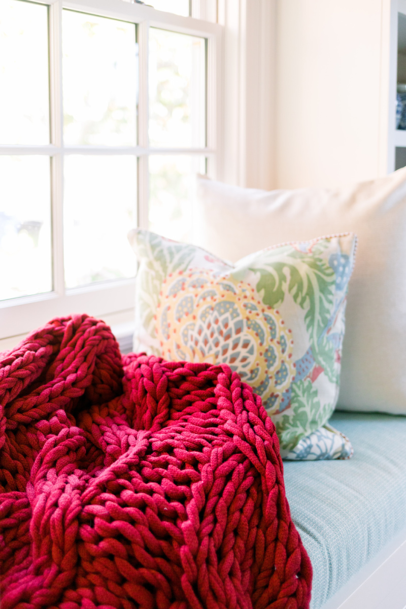 Window seat with throw and pillows