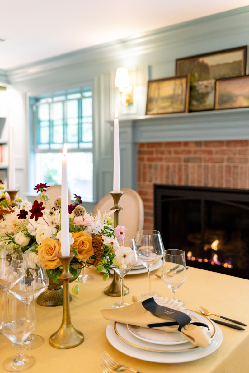 Dinner table in front of fireplace