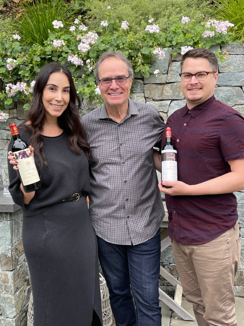 People with French Wine Bottles