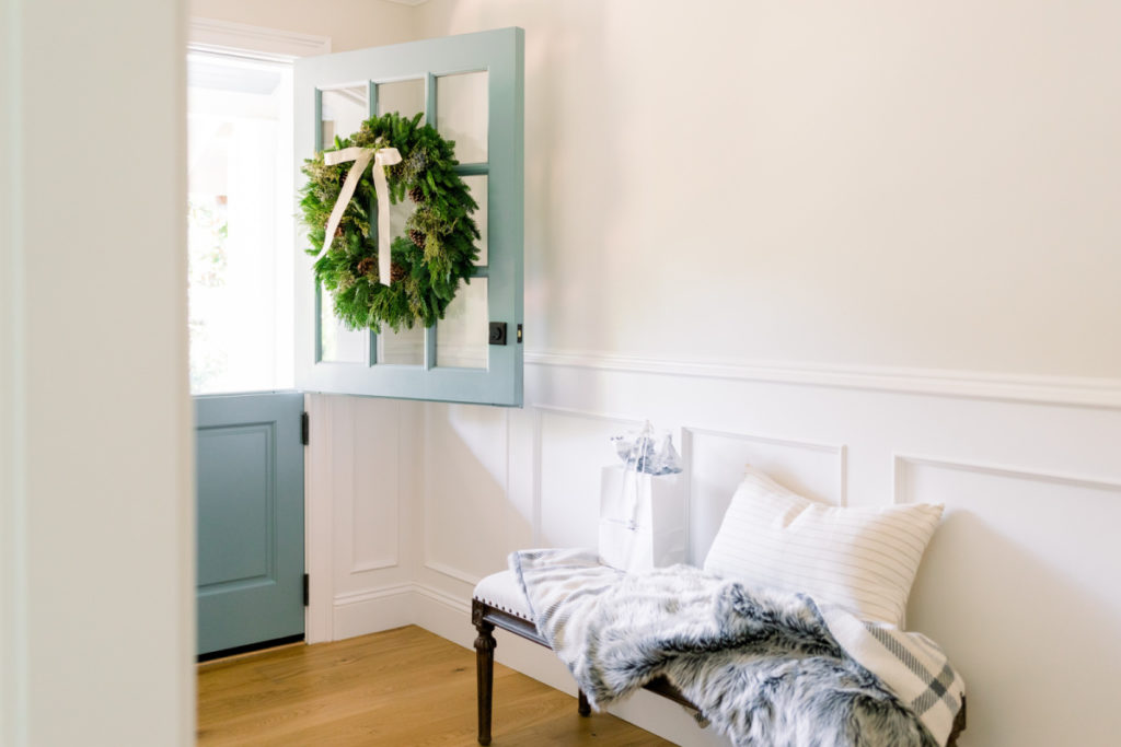 Dutch door with wreath and foyer bench