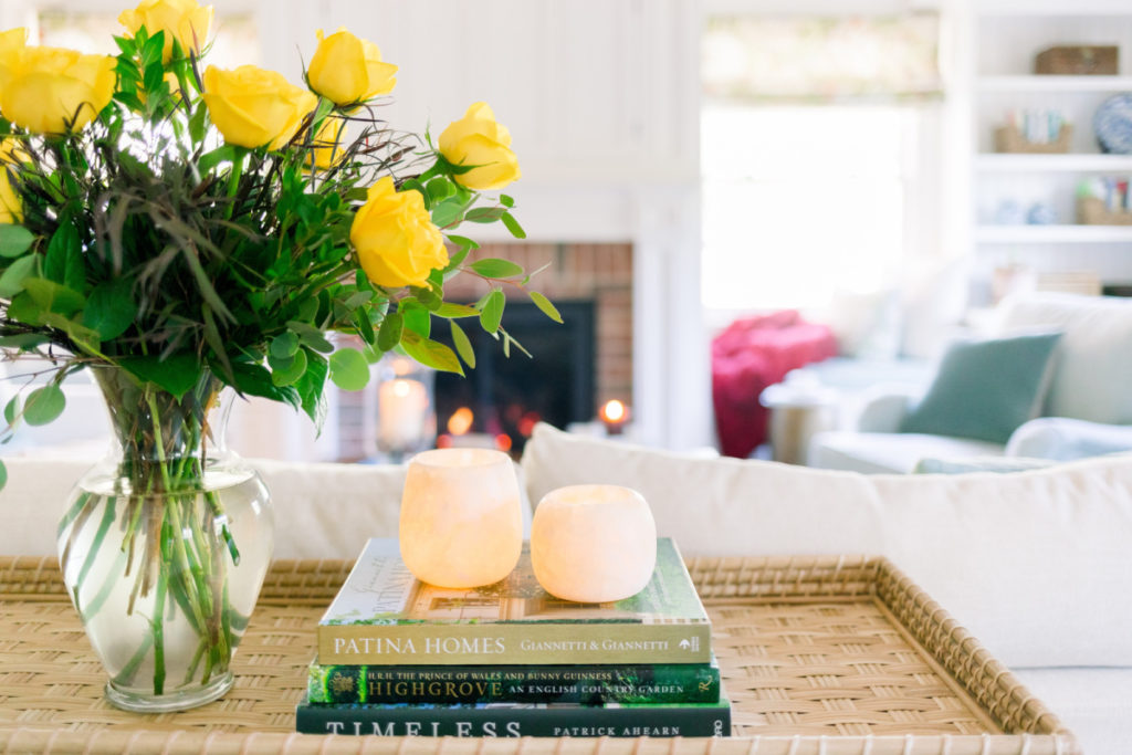 Candle vessels on book stack