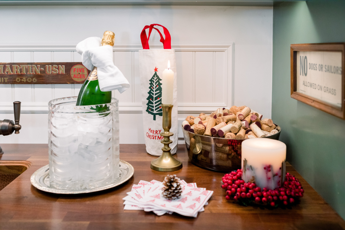 Champagne bucket of ice and champagne, holiday candles