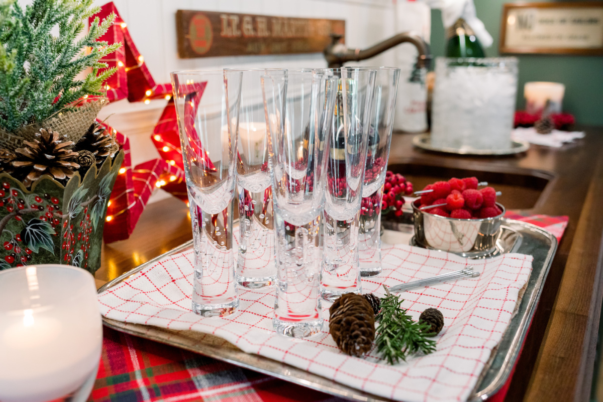 Tray of champagne glasses on bar