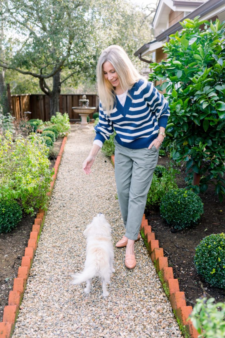 Woman and dog in garden