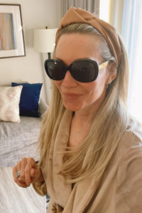 Woman wearing glasses and Skims robe.