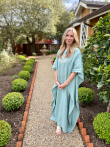 woman in monogrammed caftan