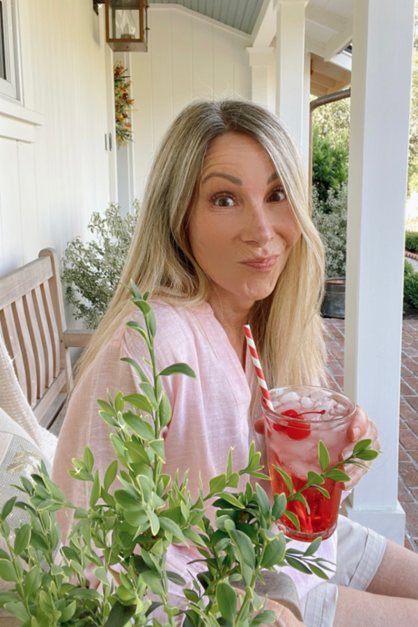 Woman on porch with drink