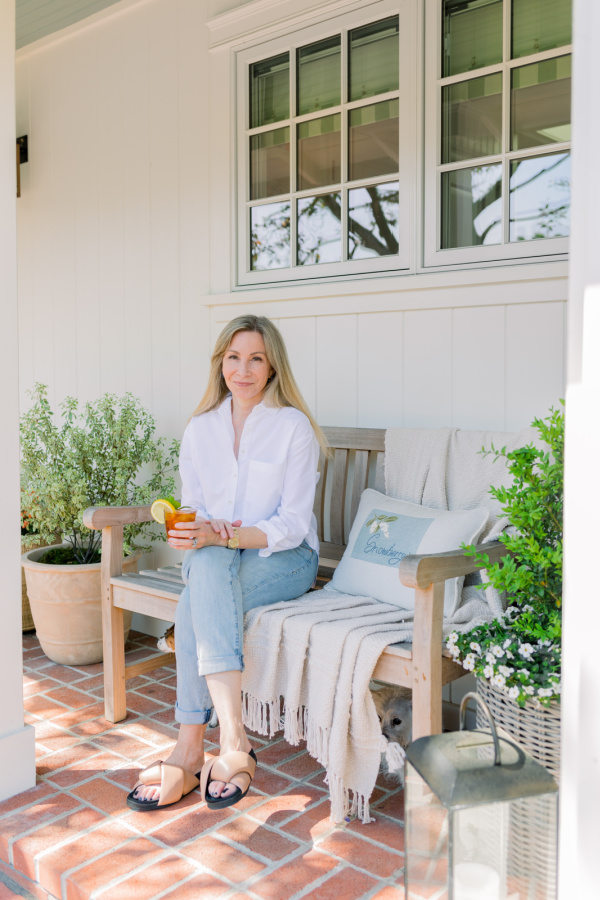 Woman on front porch bench