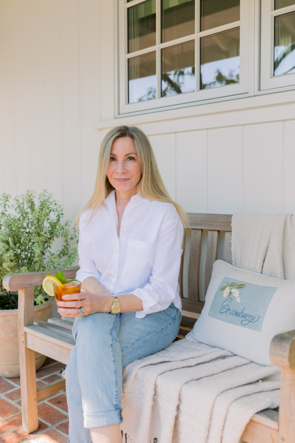 Woman on front porch bench