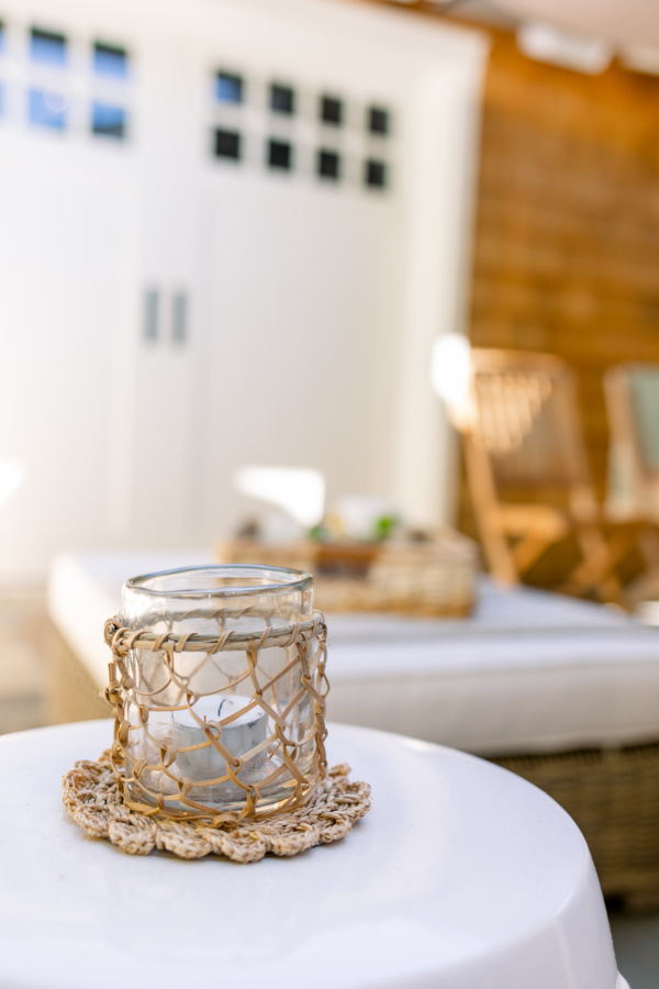 Woven votive holder on garden stool