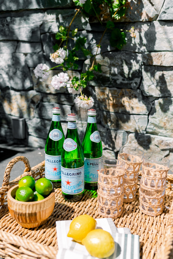 Tray water, citrus and glasses outdoor patio