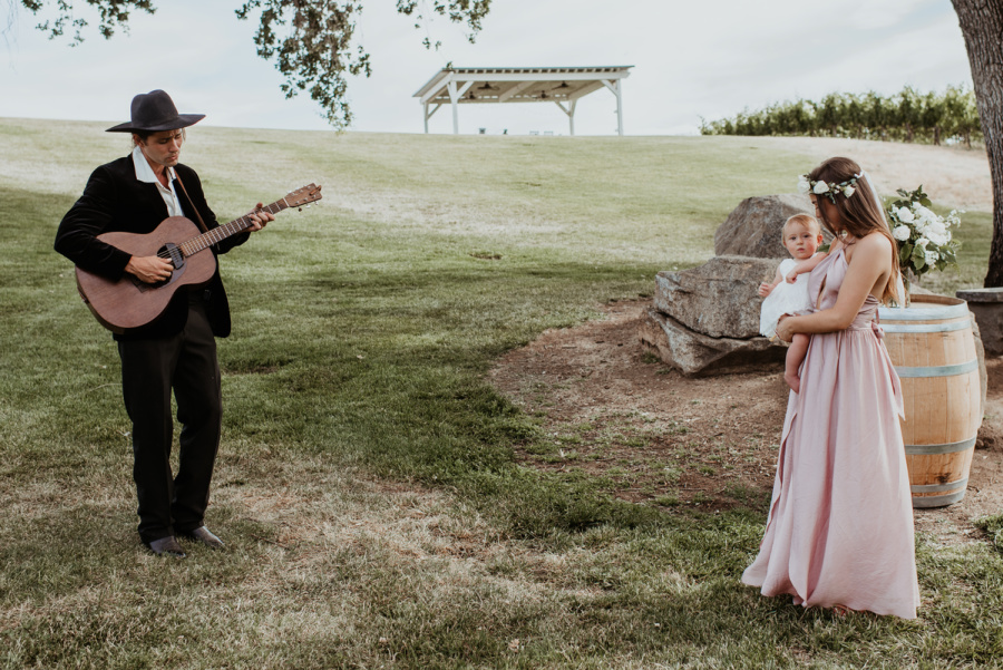 Guitarist serenading baby