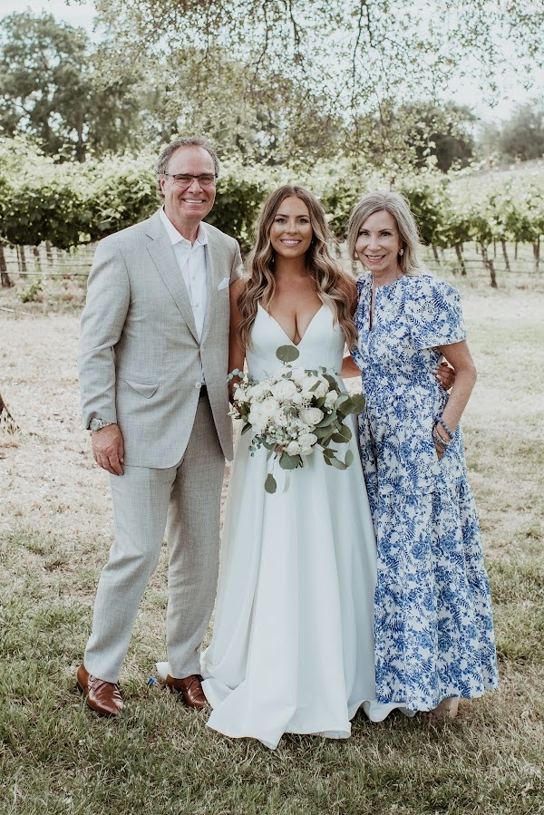 Couple with bride at wedding