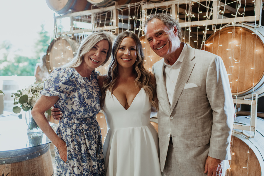 Couple with bride at wedding