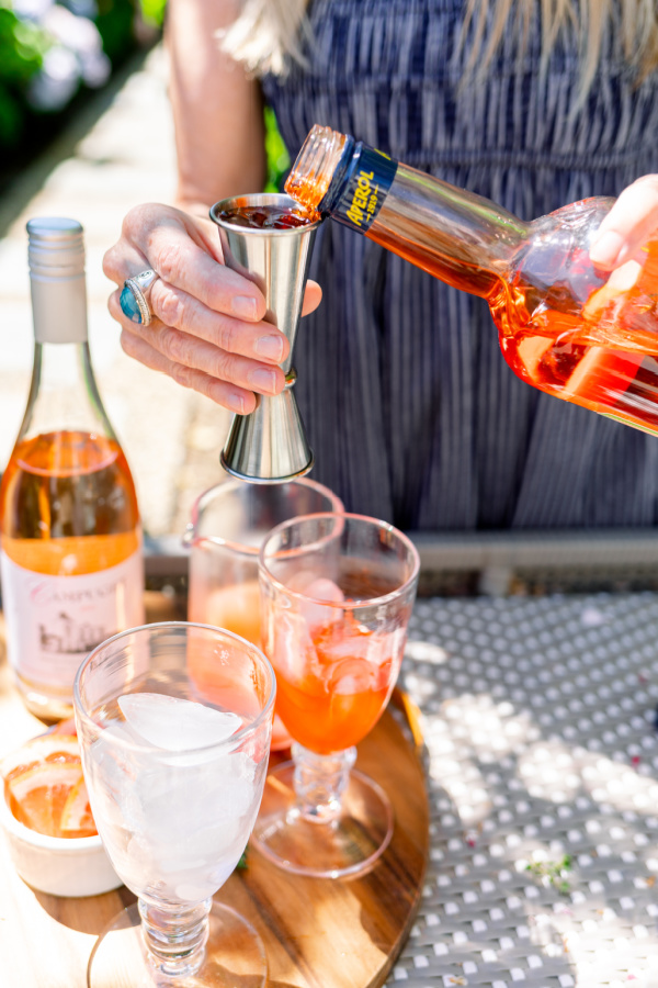 Pouring Aperol into jigger