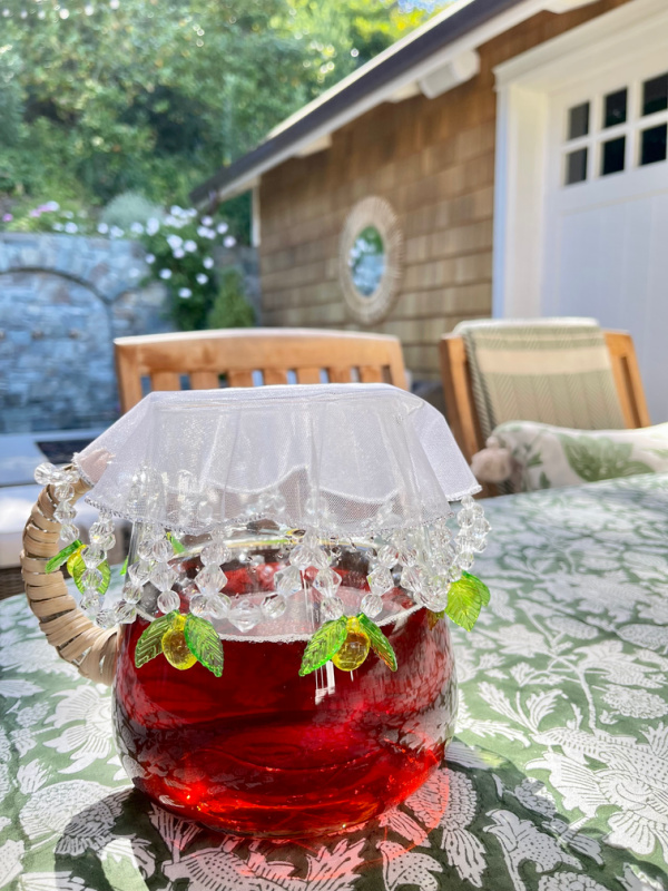 Pitcher with cover on outside table