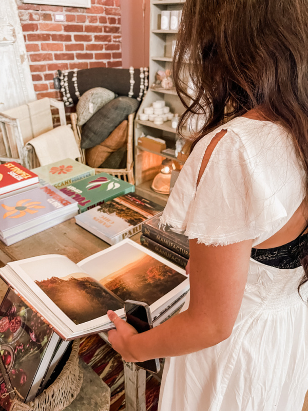 Woman looking through book at Chateau Sonoma
