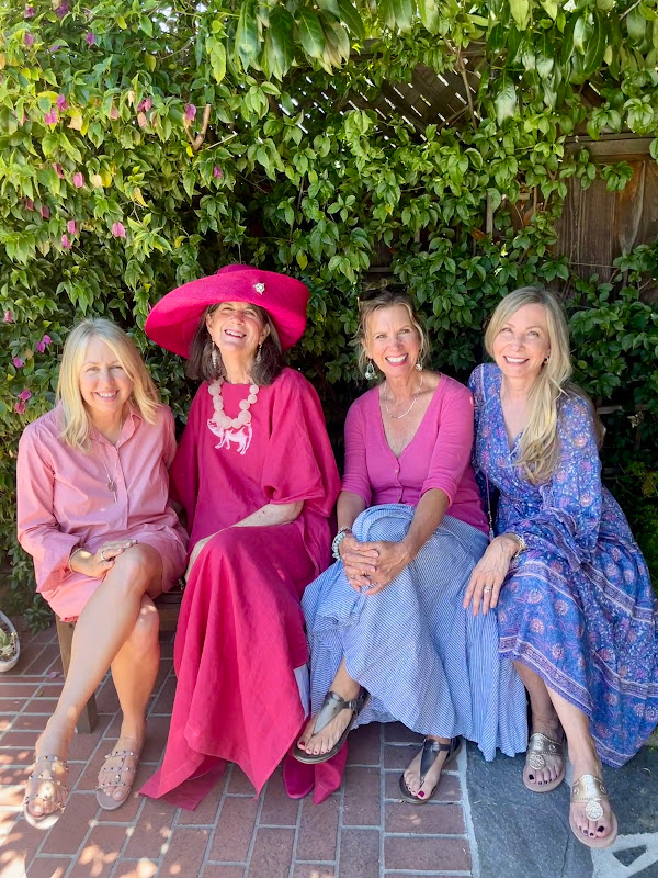 Four ladies in pink on patio