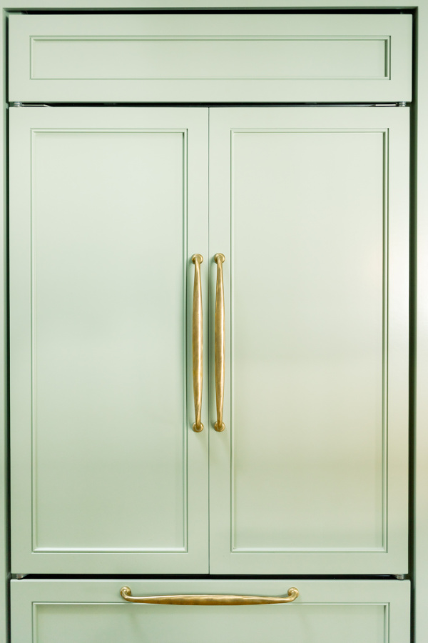 Green kitchen paneled refrigerator, paint color Farrow & Ball Vert de Terre.