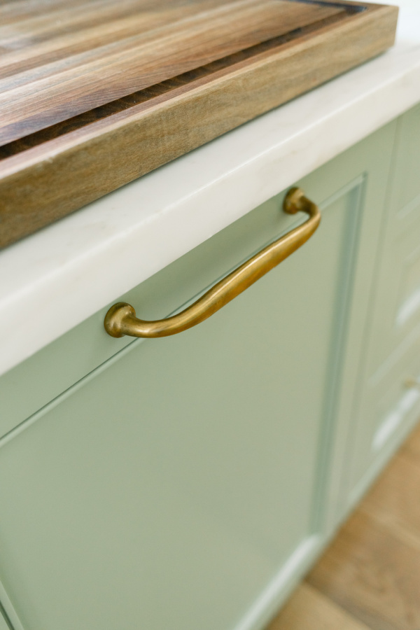 Dishwasher handle and cabinets painted Farrow & Ball Vert de Terre.