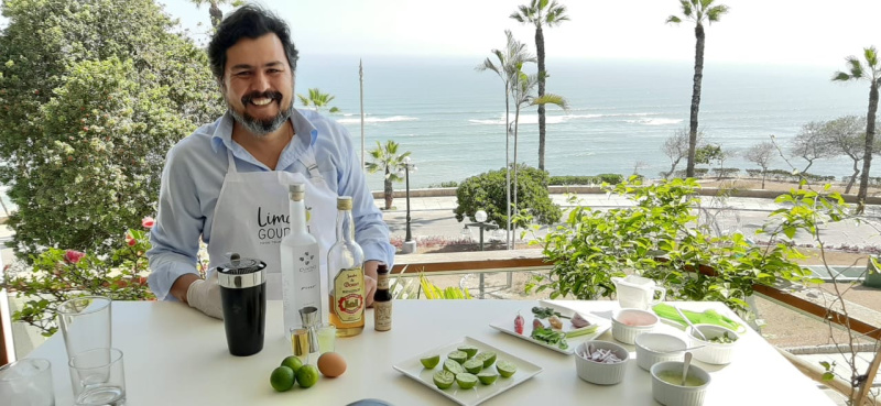 Man sitting at ocean front restaurant in Peru.
