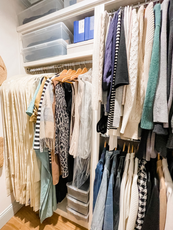 Closet organization system with clothes and shoe boxes.
