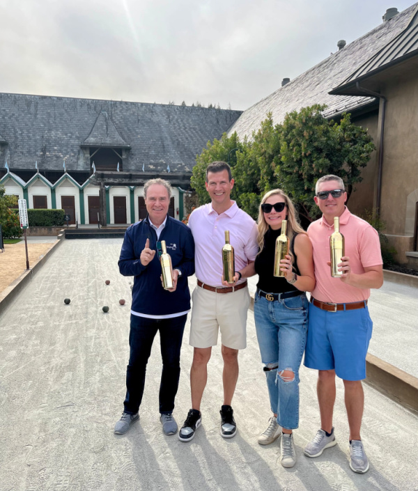 Team of four winning bocce tournament.