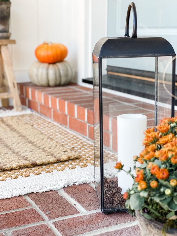 Fall front porch vignette with anthropology lanterns.