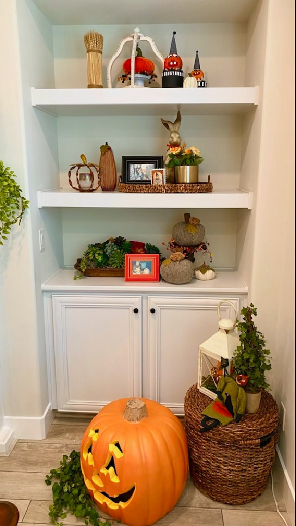 Halloween decorations on shelves.