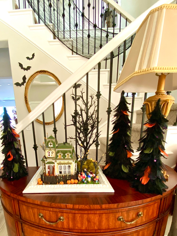 Halloween vignette on foyer console table.