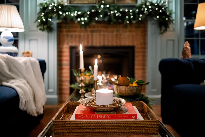 Coffee table and mantle decorated for Christmas.